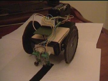 Aritza Etxebarria Ruiz: Aplicación del BASIC Stamp: un sencillo rastreador de líneas (robot rastreador, autónomo, pbasic, sensores, puerto paralelo, servos)